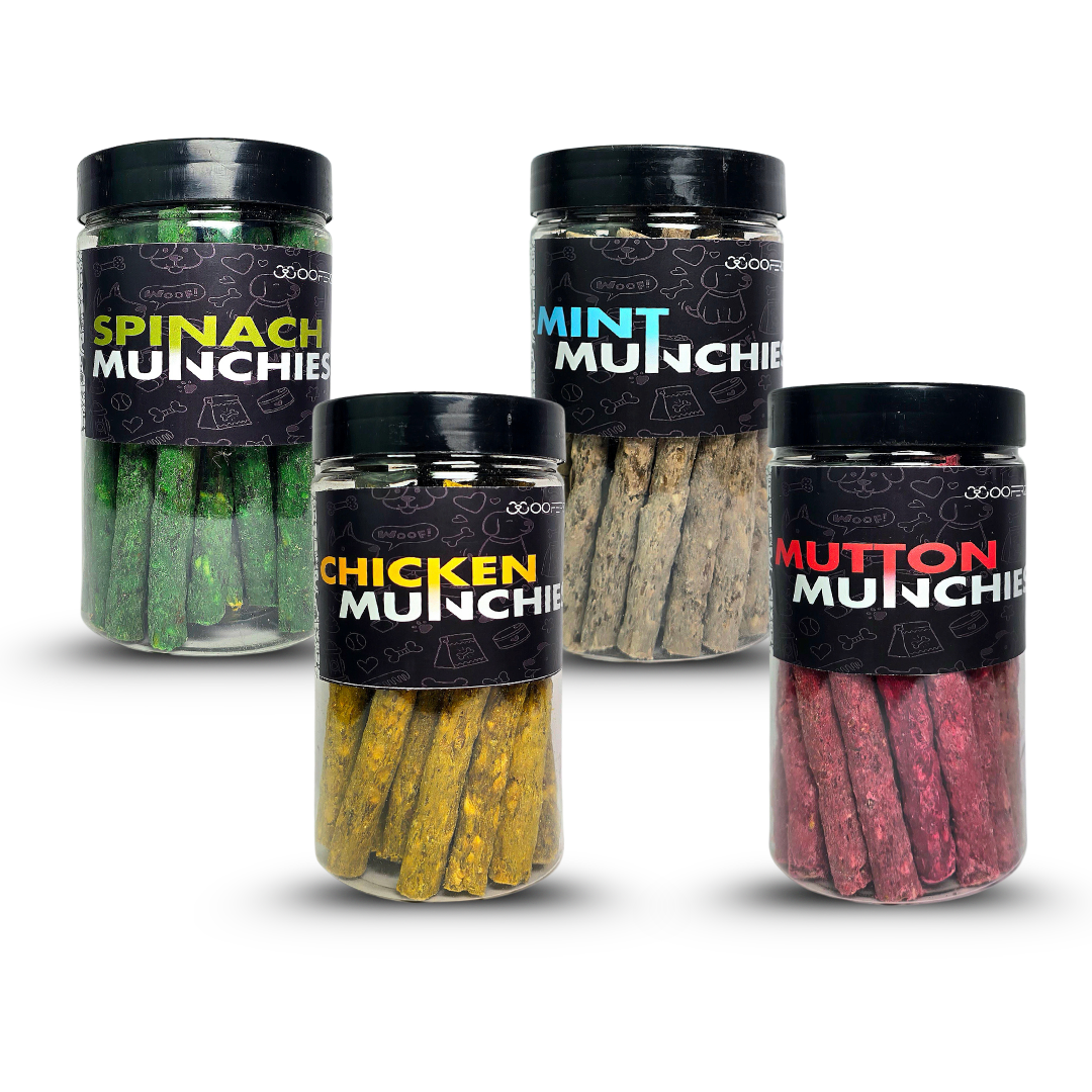 Four jars of Munchies snacks with different flavors on a white background
